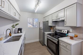 Updated kitchen at sunset winds apartments in henderson, nv 89014